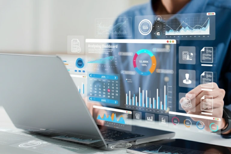 Analyst consulting data on a laptop