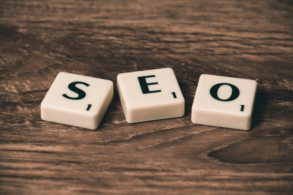 Scrabble tiles forming the word SEO on wood
