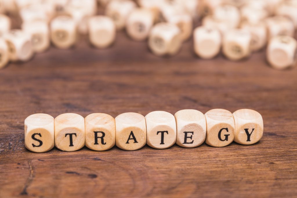 Wooden blocks with the word STRATEGY on a table