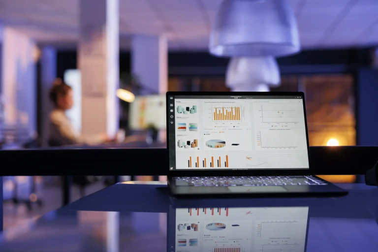 Modern office with computer displaying graphics