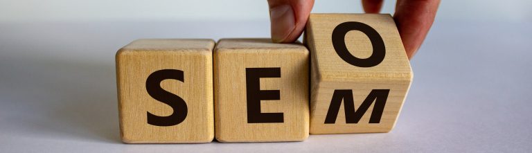 Hand adjusting wooden SEO cubes