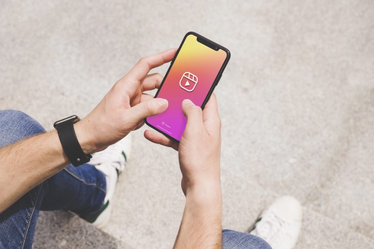 Man using smartphone with backup logo