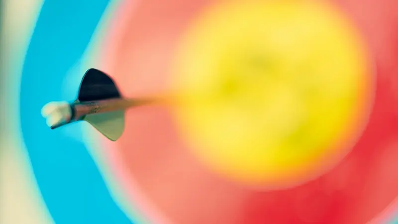 Arrow hitting the center of a colored target