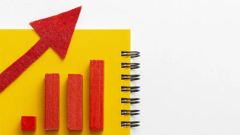 Economic growth illustrated by a red graph