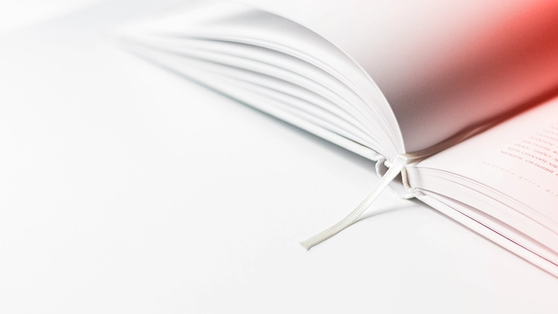 Open book with white ribbon bookmark