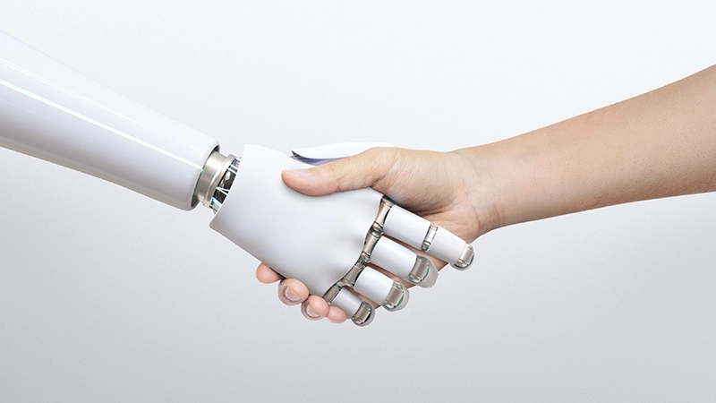 Poignée de main entre robot et humain