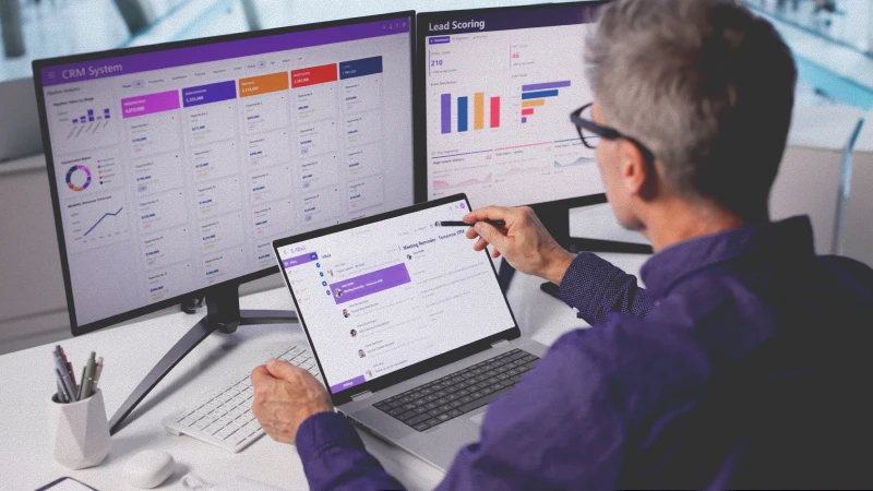 A man looking at assets on his computer.